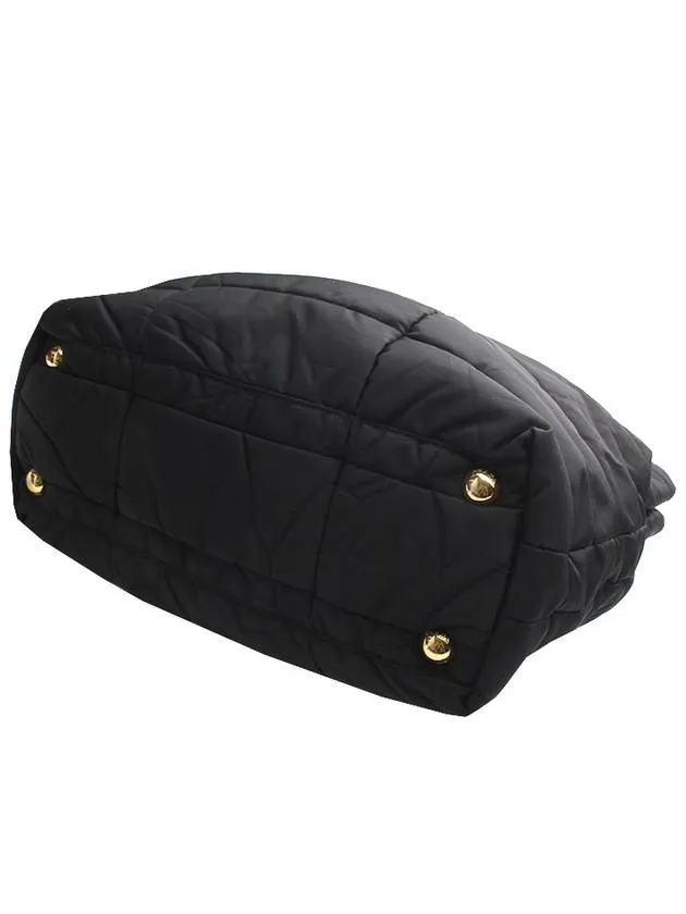 Black padded gold handle tote bag