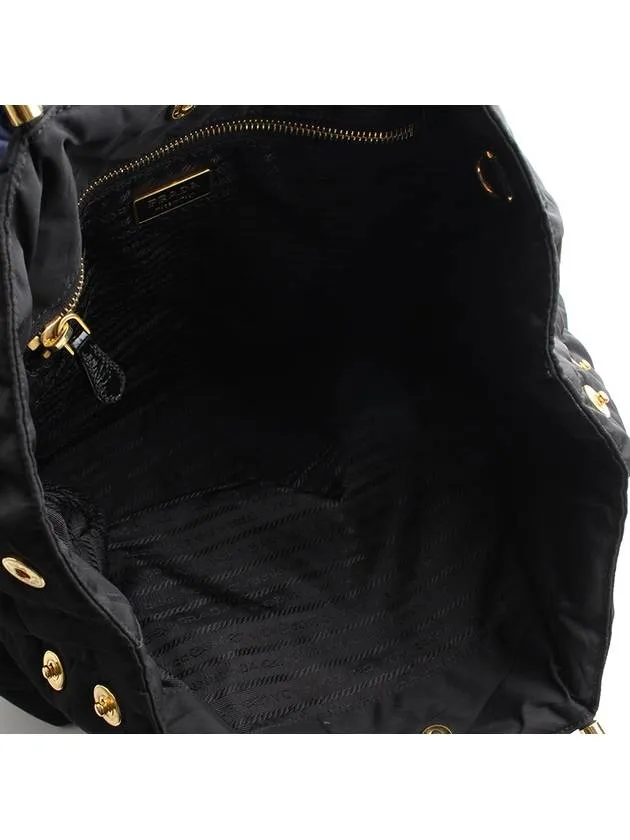 Black padded gold handle tote bag