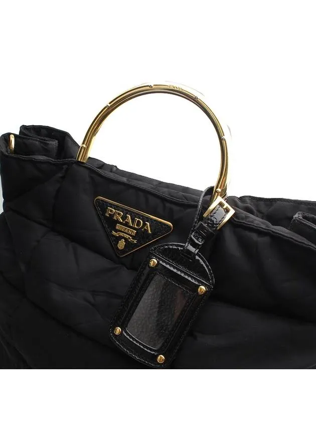 Black padded gold handle tote bag
