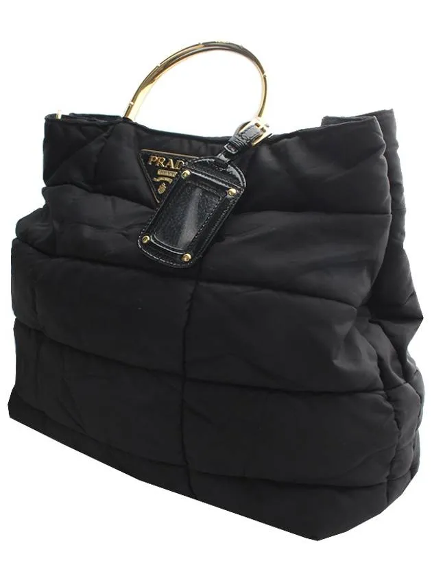 Black padded gold handle tote bag